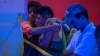Familiares de las víctimas aguardan en el exterior del local donde se ha producido el ataque.
