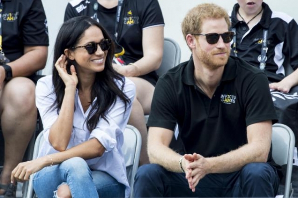 Meghan Markle junto al Príncipe Harry.