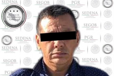 El jefe de la Agencia de Investigación Criminal (centro) detalló que junto a José Guadalupe fue detenido otro sujeto.
