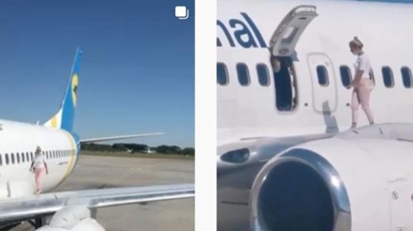 La mujer caminó por el ala del avión después de aterrizar en la capital de Ucrania, Kiev